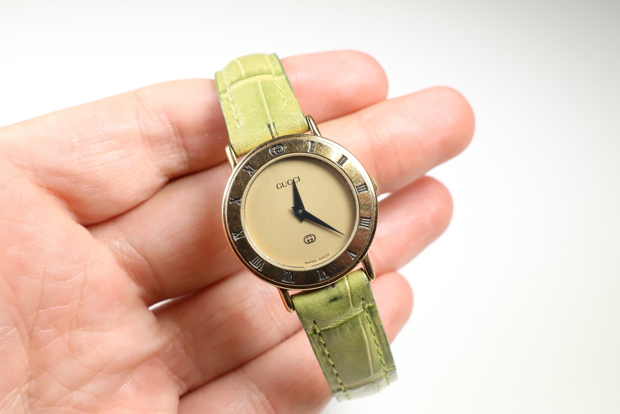 Gucci 3000L Ladies Gold-Plated Quartz Watch, Roman Numeral Bezel, Green Leather Strap