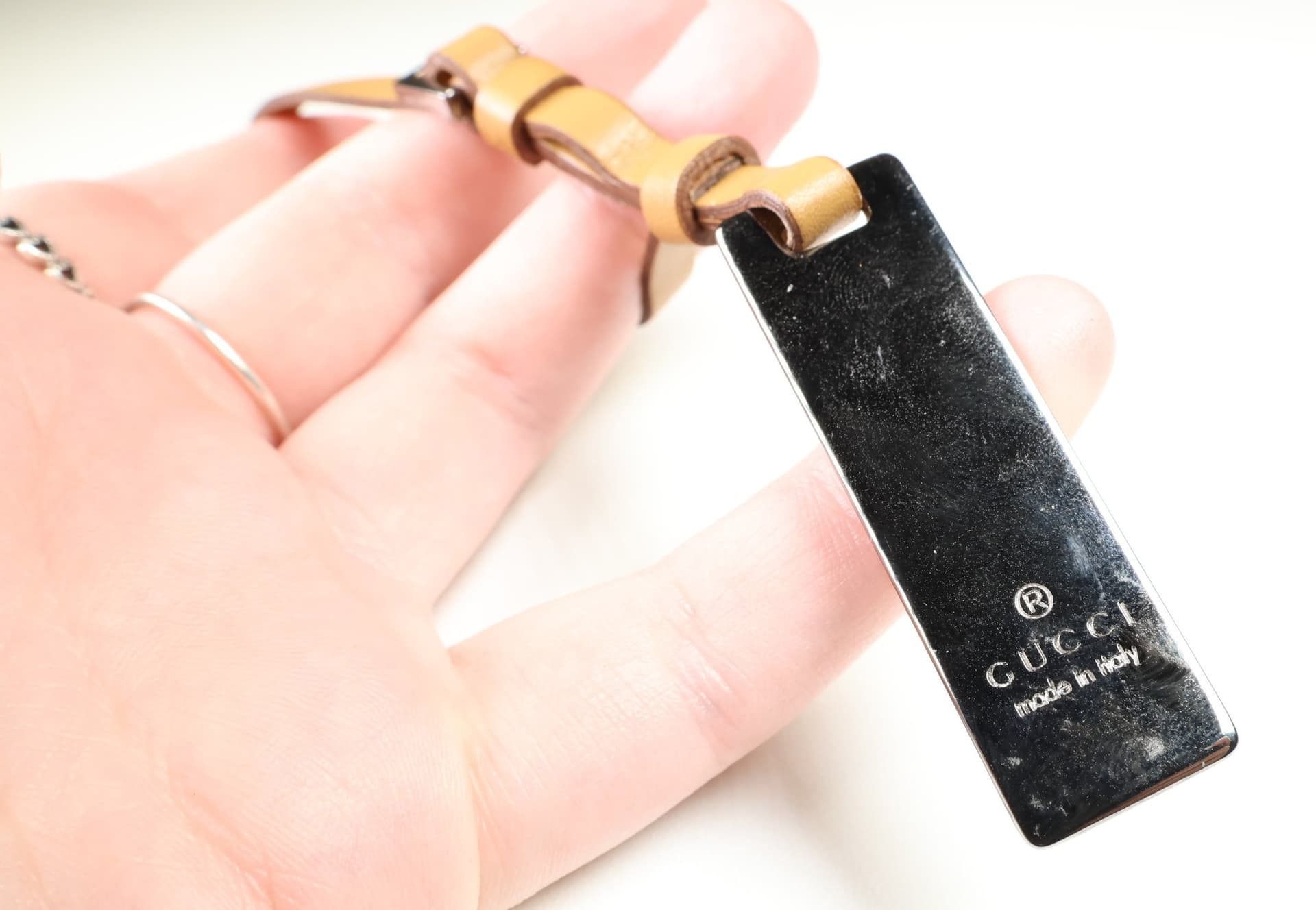 Gucci Logo Plate Bag Charm Tan Leather Buckle Strap Silver Tone Tag Charm